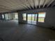 Unfinished basement with sliding glass doors to the backyard, offering potential for customization at 6036 Riesberg Ln, Castle Rock, CO 80104