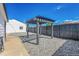 Charming backyard with a pergola feature and a rock ground cover for low maintenance at 3064 S Galapago St, Englewood, CO 80110