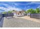 Enjoy the backyard with a charming pergola, rock area, and concrete pad for outdoor activities at 3064 S Galapago St, Englewood, CO 80110