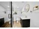 Updated bathroom with modern fixtures, glass shower, and stylish vanity at 3064 S Galapago St, Englewood, CO 80110