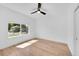A bright bedroom with a ceiling fan and a large window at 3064 S Galapago St, Englewood, CO 80110