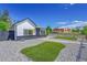 Charming home featuring stylish black and white exterior with modern rock landscaping and synthetic turf at 3064 S Galapago St, Englewood, CO 80110