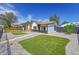 Charming home featuring stylish black and white exterior with modern rock landscaping and synthetic turf at 3064 S Galapago St, Englewood, CO 80110