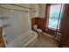 Bathroom featuring subway tiles in shower, wood paneling, and a window with a view at 1453 Vine St, Denver, CO 80206