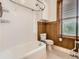 Charming bathroom featuring a classic tub with white subway tile and lovely wood accents at 1453 Vine St, Denver, CO 80206