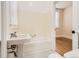 Clean bathroom featuring a vintage pedestal sink and a classic tiled floor at 1453 Vine St, Denver, CO 80206