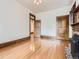 Spacious room featuring hardwood floors, fireplace, and classic wood trim at 1453 Vine St, Denver, CO 80206