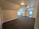 Bright and airy bedroom with neutral carpet, built-in shelving, and large windows at 1453 Vine St, Denver, CO 80206