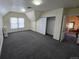 Bright and airy bedroom with neutral carpet, closet, and large windows at 1453 Vine St, Denver, CO 80206