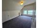 Bright and airy bedroom with neutral carpet, built-in shelving, and large windows at 1453 Vine St, Denver, CO 80206