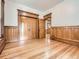 Bedroom featuring decorative wood trim, spacious layout, and hardwood floors at 1453 Vine St, Denver, CO 80206