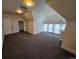 Bright and airy bedroom with neutral carpet, closet, and large windows at 1453 Vine St, Denver, CO 80206