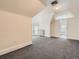 Bedroom with gray carpet, radiator and doorway to bathroom at 1453 Vine St, Denver, CO 80206