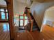 Elegant foyer with hardwood floors, grand staircase, and decorative wood trim leading to various rooms at 1453 Vine St, Denver, CO 80206