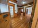 Inviting foyer featuring gleaming hardwood floors and beautiful wood trim throughout the home at 1453 Vine St, Denver, CO 80206