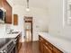 Bright kitchen with wood cabinets, stainless steel appliances, white countertops and hardwood floors at 1453 Vine St, Denver, CO 80206