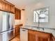 Well-equipped kitchen with stainless steel appliances, granite countertops and wooden cabinets at 1453 Vine St, Denver, CO 80206