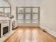 Bright living room with decorative fireplace, large windows, and detailed ceiling ornamentation at 1453 Vine St, Denver, CO 80206