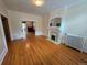 Charming living room with hardwood floors, fireplace, and classic radiator at 1453 Vine St, Denver, CO 80206