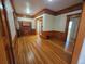 Spacious living room with hardwood floors, wood trim, and doorway access at 1453 Vine St, Denver, CO 80206