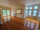 Inviting living room features shining hardwood floors, natural light, and neutral wall tones for a comfortable space at 1453 Vine St, Denver, CO 80206