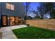 An attractive backyard features a well-maintained lawn, patio, and privacy fence for outdoor enjoyment at 2378 S Bannock St, Denver, CO 80223