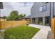 Lovely modern backyard with grass and concrete patio area perfect for relaxation and entertaining at 2378 S Bannock St, Denver, CO 80223