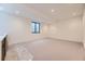 Spacious finished basement area with a built-in bar and comfortable carpeting at 2378 S Bannock St, Denver, CO 80223