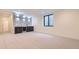 Spacious basement with a modern bar, sleek countertops, and a stylish beverage refrigerator at 2378 S Bannock St, Denver, CO 80223