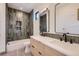 Modern bathroom featuring double vanity, a bath tub, and stylish tile design at 2378 S Bannock St, Denver, CO 80223