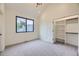 Neutral colored bedroom with closet and a window providing natural light at 2378 S Bannock St, Denver, CO 80223