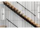 Modern staircase with wooden steps and metal railing at 2378 S Bannock St, Denver, CO 80223