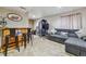 Finished basement featuring a bar, sofa, accent lighting and tile flooring at 20651 E 42Nd Ave, Denver, CO 80249