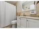 Bathroom with a toilet, shower behind a curtain and a modern vanity with sink at 20651 E 42Nd Ave, Denver, CO 80249