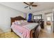 Well-lit bedroom offers space for relaxation and rest, complete with stylish furniture and ceiling fan at 20651 E 42Nd Ave, Denver, CO 80249