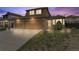 Beautiful two-story home with a three-car garage, stone accents and manicured lawn at 20651 E 42Nd Ave, Denver, CO 80249