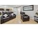 Inviting living room features modern furniture, a stylish barn door, and access to other living areas at 20651 E 42Nd Ave, Denver, CO 80249