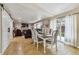 Spacious living room includes a fireplace, comfortable seating, access to the backyard, and dining area at 20651 E 42Nd Ave, Denver, CO 80249