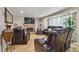 Comfortable living room featuring a brick fireplace, plush seating, and ample space for relaxation and entertaining at 20651 E 42Nd Ave, Denver, CO 80249