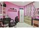 Salon room featuring pink walls, shelving, and a styling chair at 20651 E 42Nd Ave, Denver, CO 80249