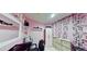 Salon room featuring pink walls, shelving, and a styling chair at 20651 E 42Nd Ave, Denver, CO 80249