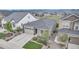 Aerial view of a single-Gathering home with landscaping in a neighborhood with mountain views in the distance at 9055 Swan River St, Littleton, CO 80125