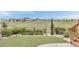 Landscaped backyard featuring rock accents, green lawn, and a charming wooden fence at 9055 Swan River St, Littleton, CO 80125