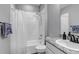 Cozy bathroom with shower over bath and vanity with granite counter at 9055 Swan River St, Littleton, CO 80125