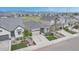 Landscaped gray single-Gathering house with stone facade, a two-car garage, and well maintained yard in neighborhood at 9055 Swan River St, Littleton, CO 80125