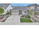 Beautiful single-Gathering home with stone accents, a well-manicured lawn, and a spacious driveway for convenient parking at 9055 Swan River St, Littleton, CO 80125