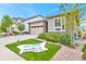 Charming single-Gathering home with a manicured lawn and an attached two-car garage and visible open house banner at 9055 Swan River St, Littleton, CO 80125