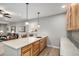 Features a beautiful wet bar with a sink, tile backsplash, and pendant lighting above the countertop at 9055 Swan River St, Littleton, CO 80125