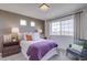 Bright bedroom with a large window and warm, inviting decor and a sitting chair at 1176 Sugarloaf Ln, Erie, CO 80516