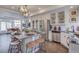 Spacious kitchen features an island, stainless appliances, ample counter space, and modern lighting at 1176 Sugarloaf Ln, Erie, CO 80516